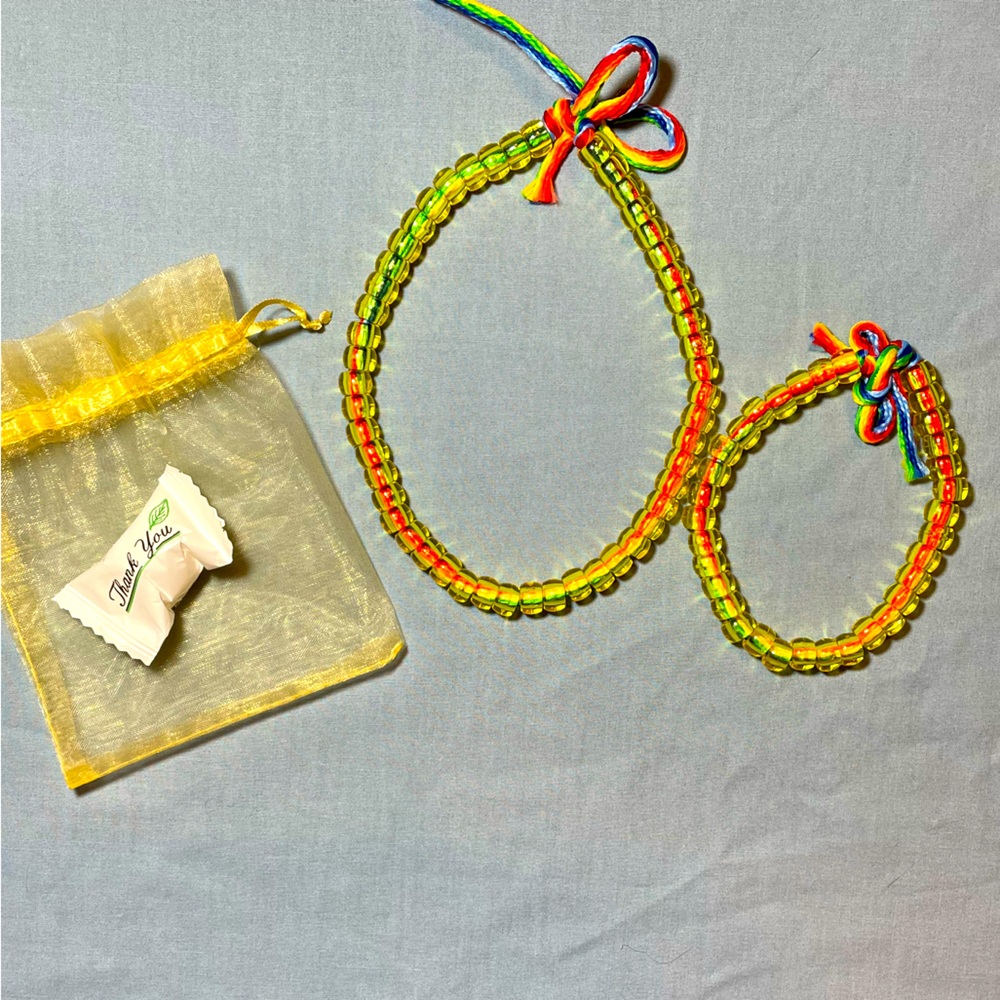 2pc. sheer yellow bead choker/bracelet set with small rainbow rope that ties.